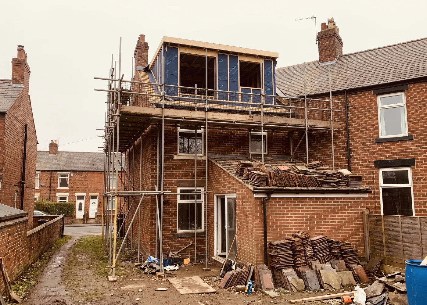 A rear dormer under construction on a terraced house